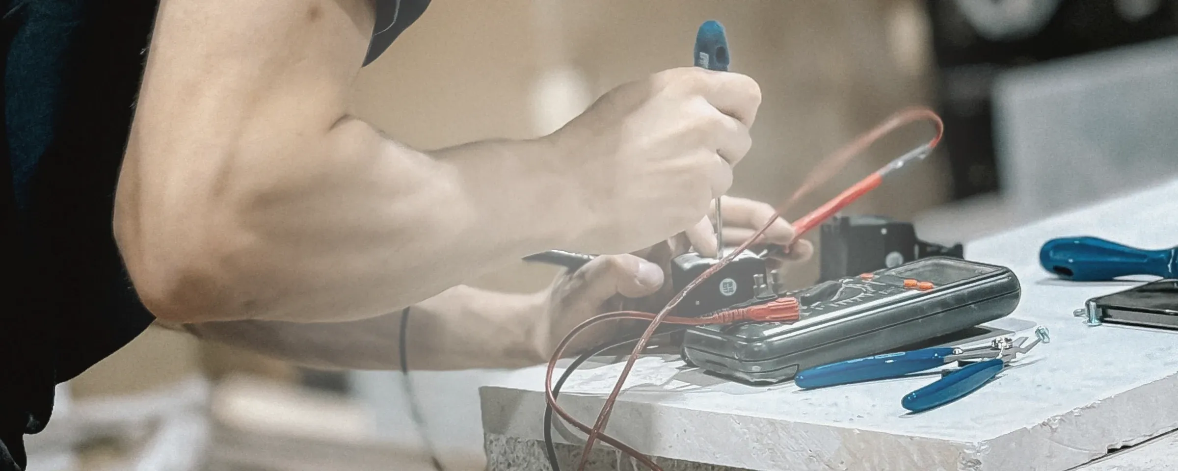 Electrical technician working at an industrial test bench