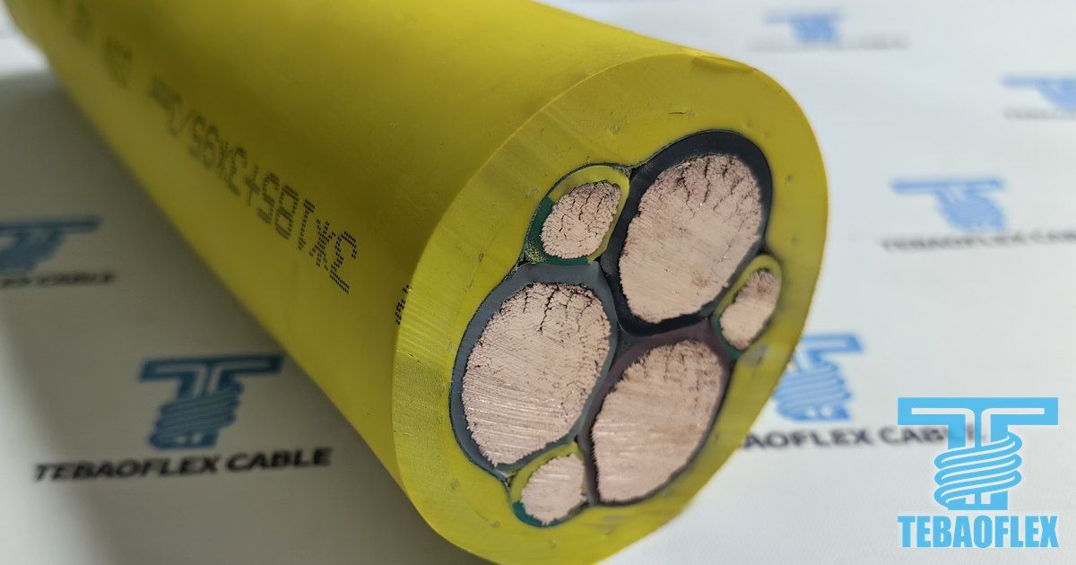 Cut end of a yellow (N)SHTÖU-J 3x185+3x95/3 reeling cable with three large power cores and three small green-yellow earth cores